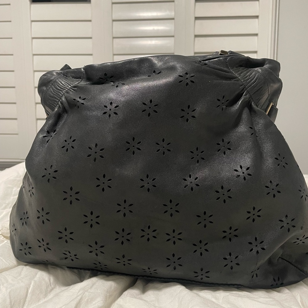 Salvatore Ferragamo authentic black Gancini floral perforated purse